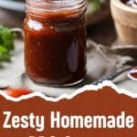A close-up photo of a mason jar filled with homemade spicy barbecue sauce.