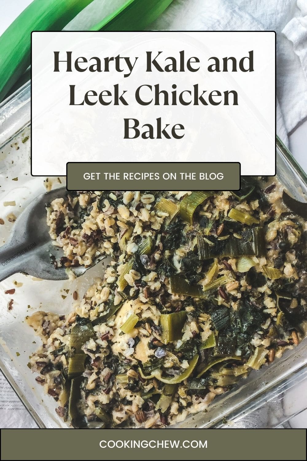 A close-up photo of a rustic chicken bake casserole dish filled with leeks, kale, and rice.