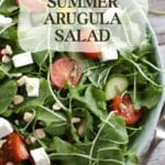 A simple and refreshing summer salad with peppery arugula, sweet cherry tomatoes, tangy feta cheese, and fragrant fresh herbs.
