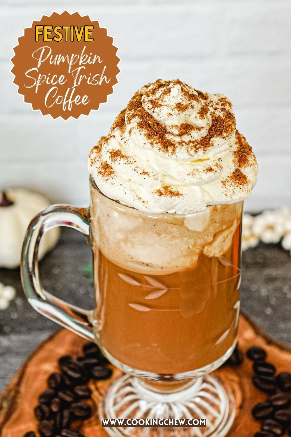 A festive cup filled with pumpkin spice Irish coffee, topped with whipped cream.