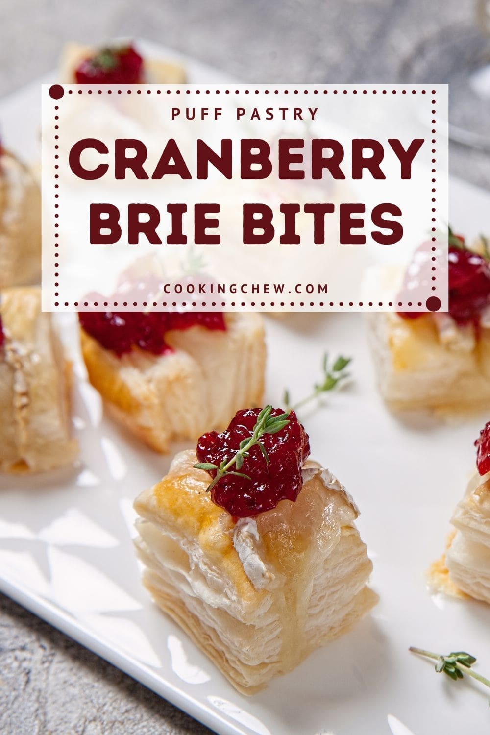 A photo of a cranberry brie bites on a white plate.