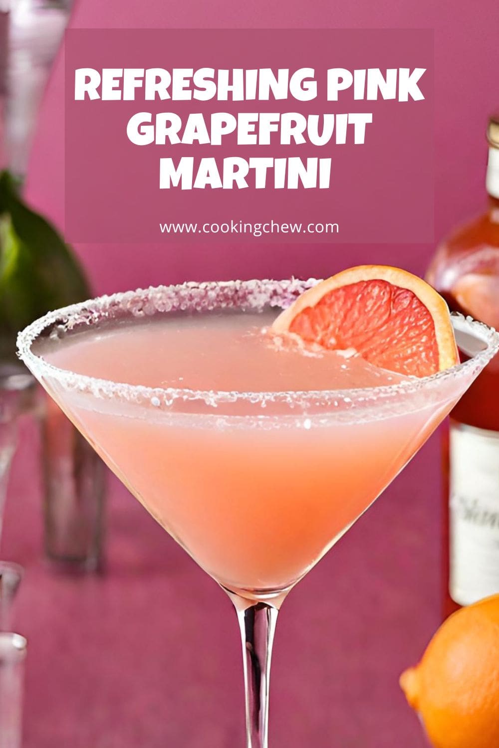 A close-up photo of a vibrant pink grapefruit martini in a coupe glass. 