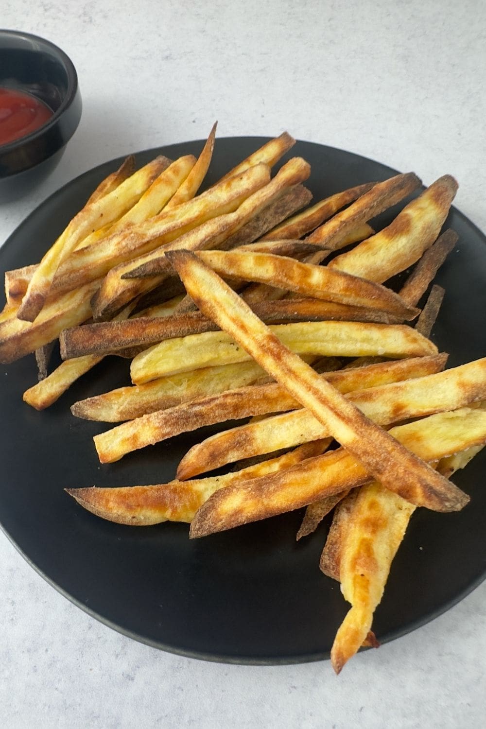 Healthy sweet potato fries recipe made in the air fryer, crispy on the outside and tender on the inside.