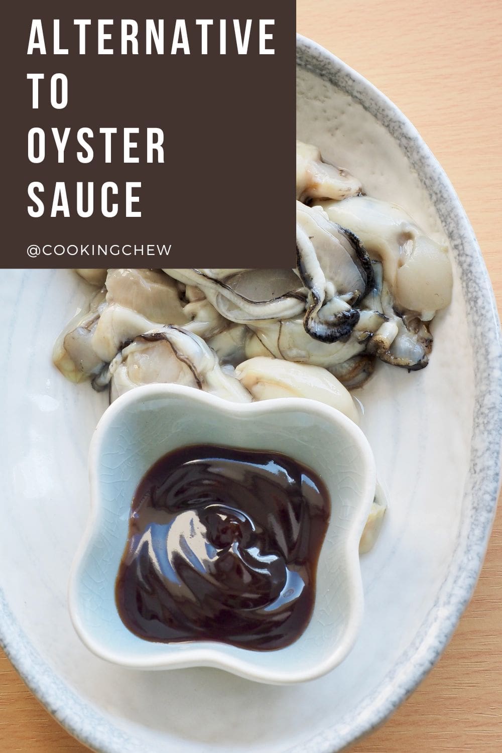 A close-up photo of a plate of fresh oysters with oyster sauce on a plate.