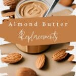 A close-up photo of a glass jar of almond butter on a wooden table.