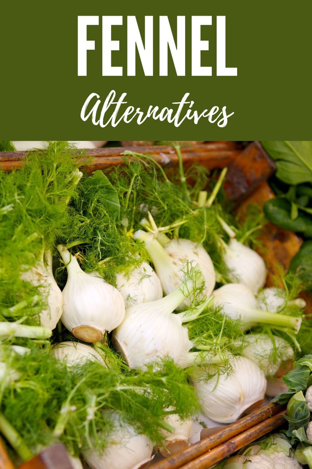 A wooden crate overflowing with fresh fennel bulbs.