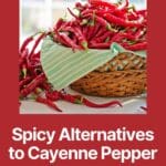 A basket filled with red cayenne peppers on a wooden table.