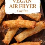 A close-up look at the golden brown exterior and crisp texture of air-fried vegan taquitos.