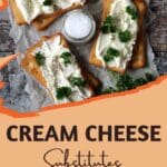 Crackers topped with cream cheese and parsley.