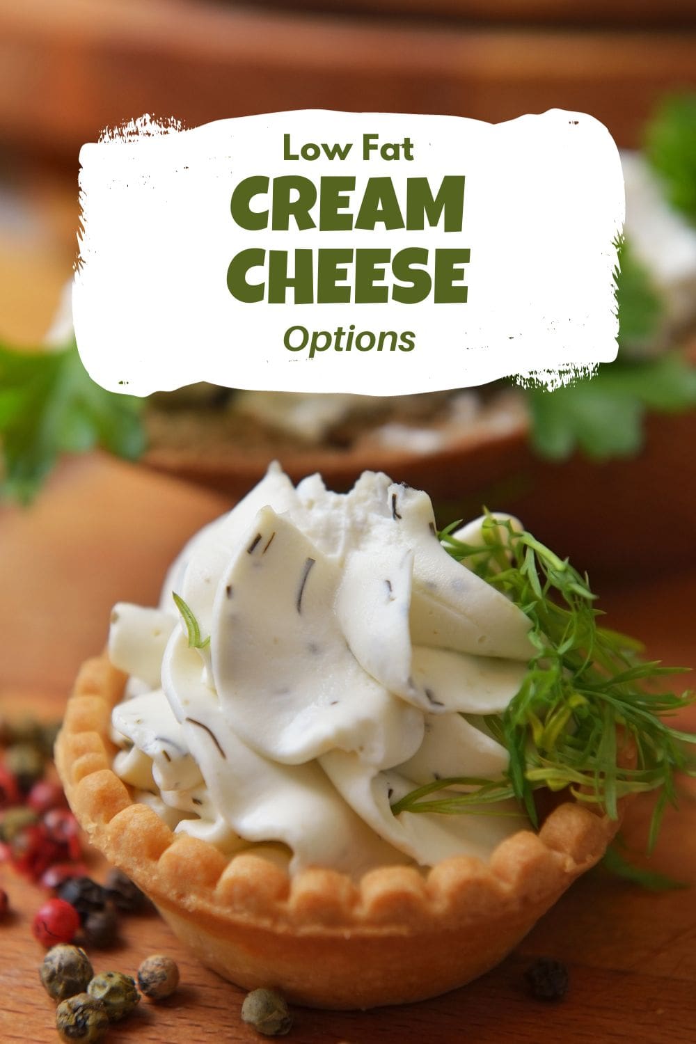 Tartelette topped with cream cheese and herbs.