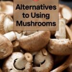 A close-up photo of a bowl of white button mushrooms.