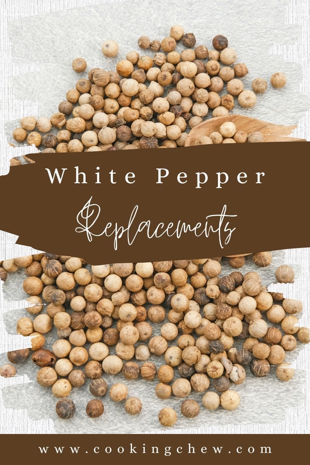 A close-up photo of a pile of white pepper on a light-colored wooden table.