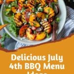 Grilled peach salad with feta and arugula, surrounded by fresh peaches on the side.