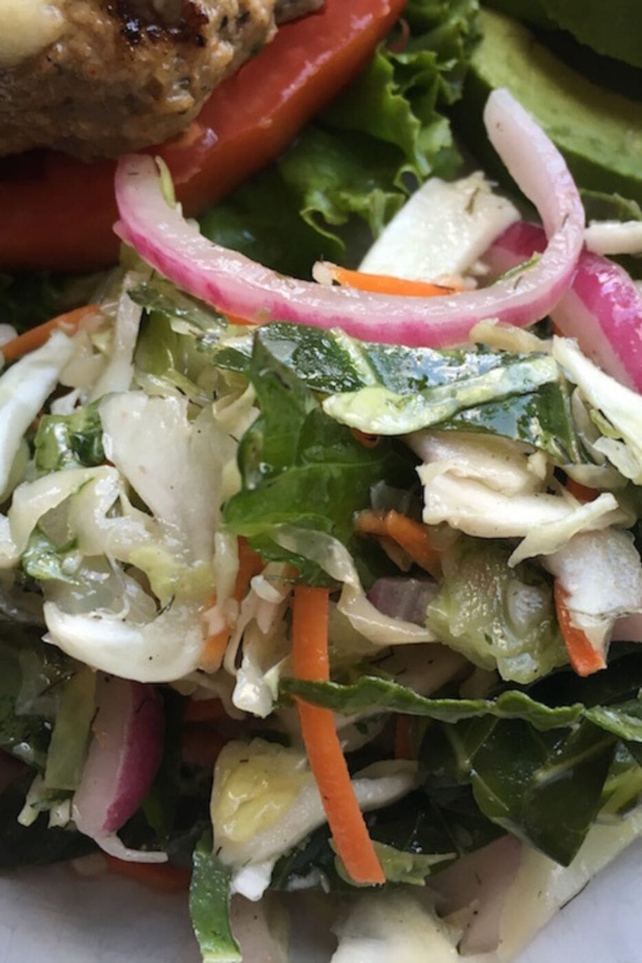 A bowl of crunchy, colorful Carolina coleslaw with a light vinegar dressing