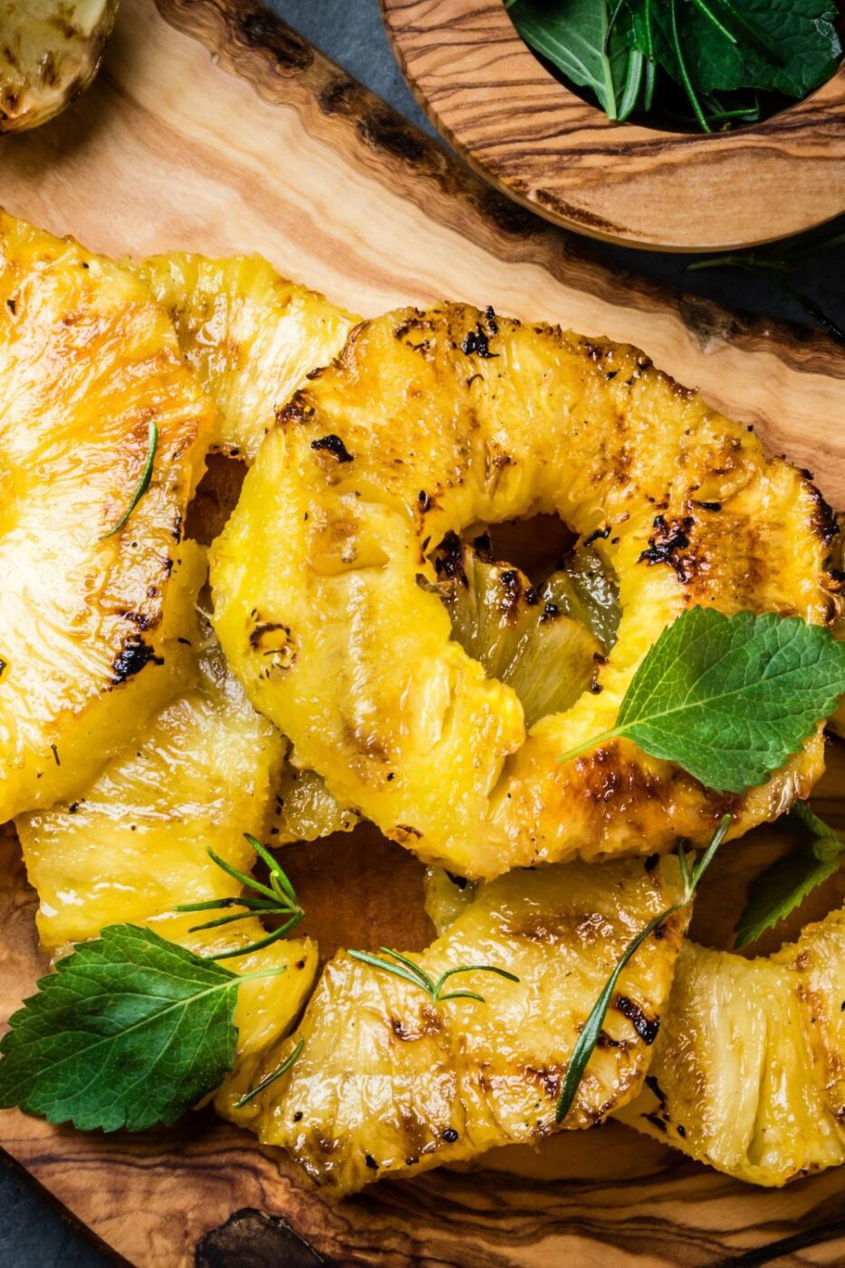 Juicy, caramelized pineapple slices on a hot grill with golden grill marks