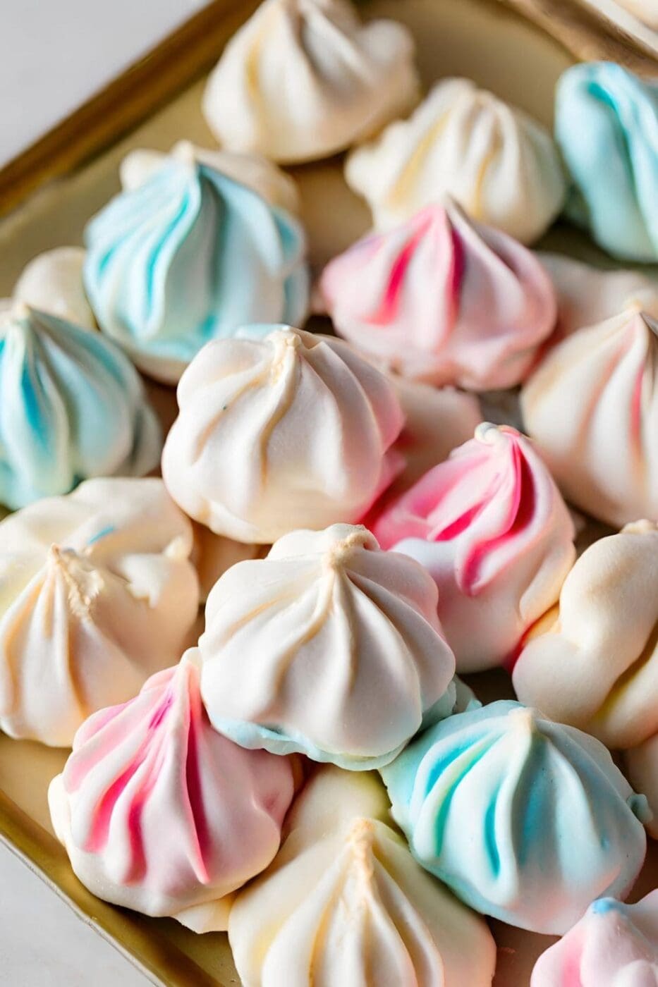 A close-up photo of a tray of Christmas Meringue Cookies