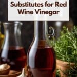 A close-up photo of a variety of red wine vinegar substitutes displayed on a wooden table.