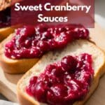 A close-up image of bread with cranberry sauce on top.