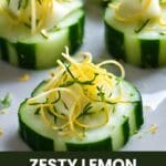 A plate of cucumber slices with lemon zest and cheese on top.