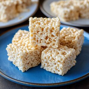 Close-up of the best Rice Krispie treats with a golden finish.​