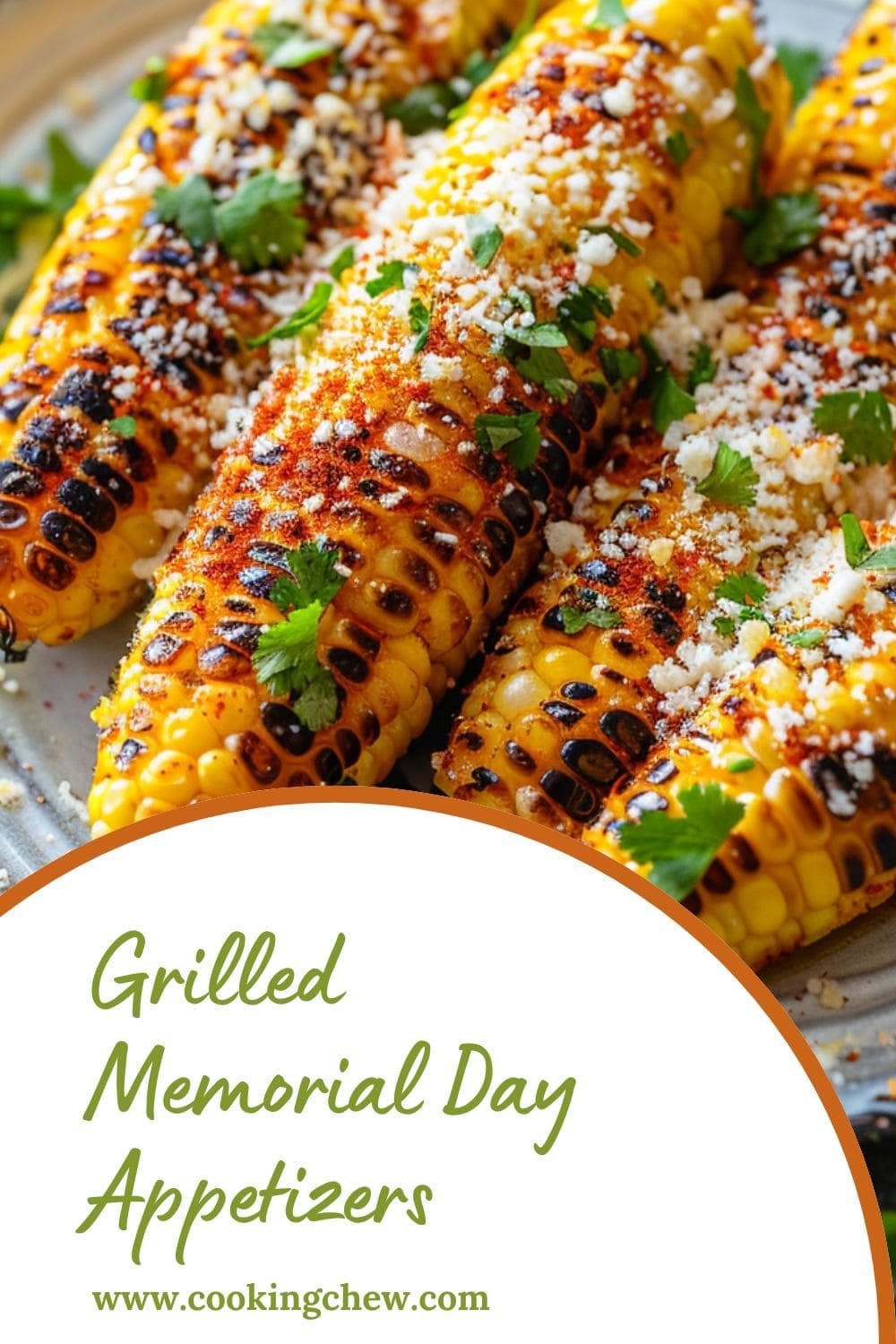 A plate of four grilled corn cobs dusted with a yellow, crumbly cheese and topped with fresh green cilantro.