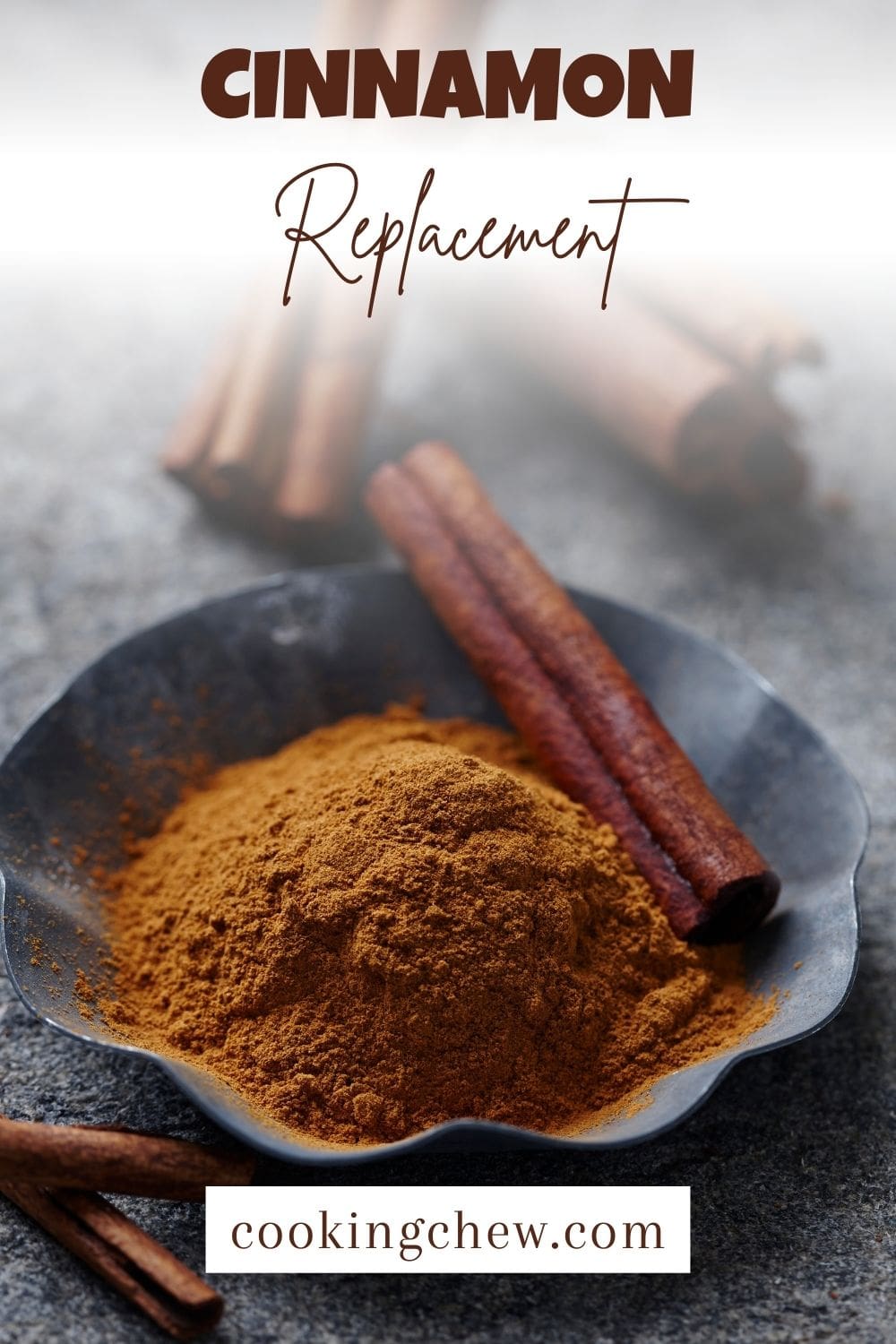 A close-up photo of a bowl filled with ground cinnamon powder next to several cinnamon sticks on a wooden table.