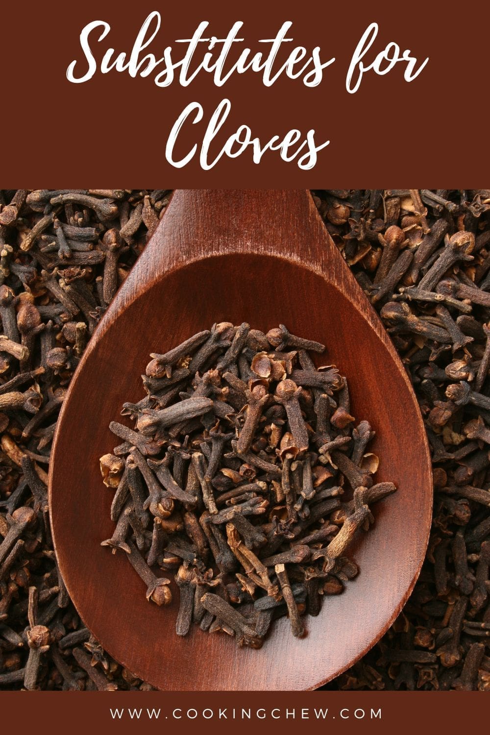 A close-up photo of a wooden spoon overflowing with dried clove buds on a dark table.