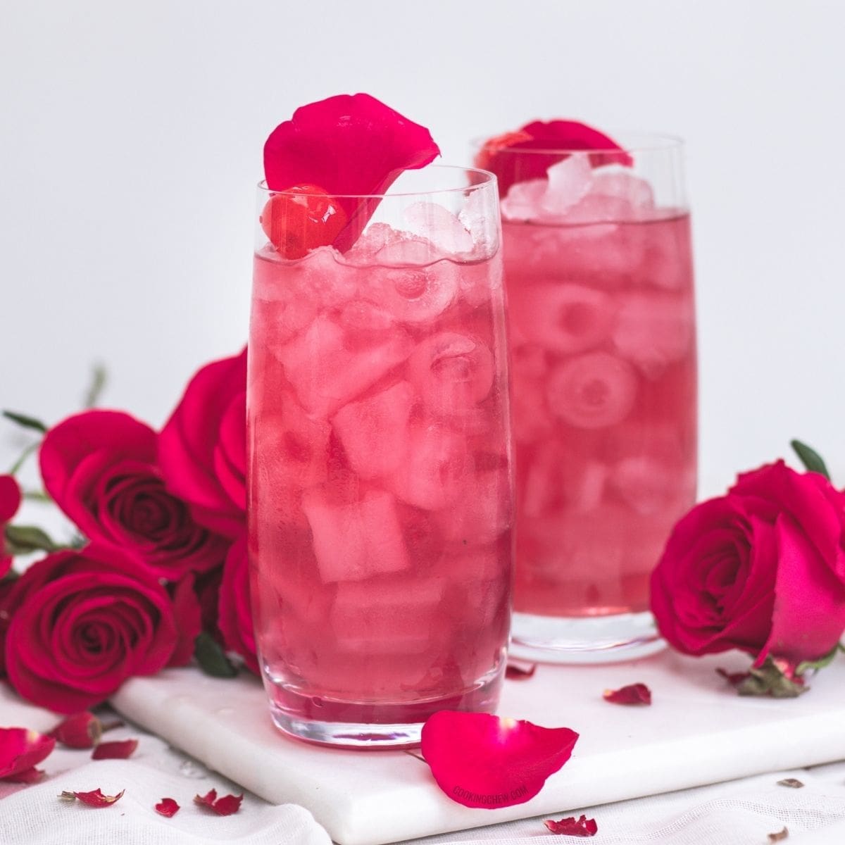 A close-up of a glass filled with a cranberry vodka cocktail.