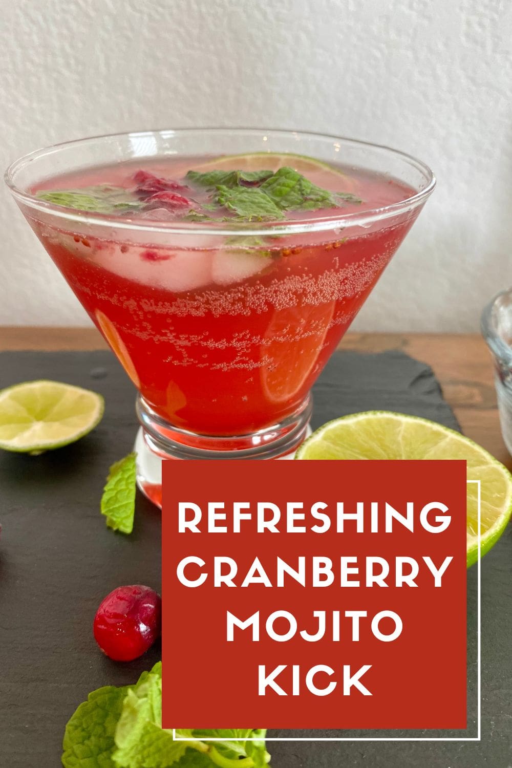 A refreshing cranberry mojito kick in a cocktail glass.