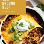 A close-up photo of a comforting American classic: cheesy ground beef and pasta casserole.