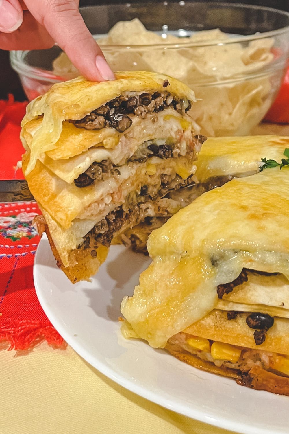 A close-up photo of a sliced Mexican tortilla casserole.