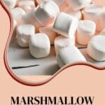 A stack of marshmallows on a wooden table