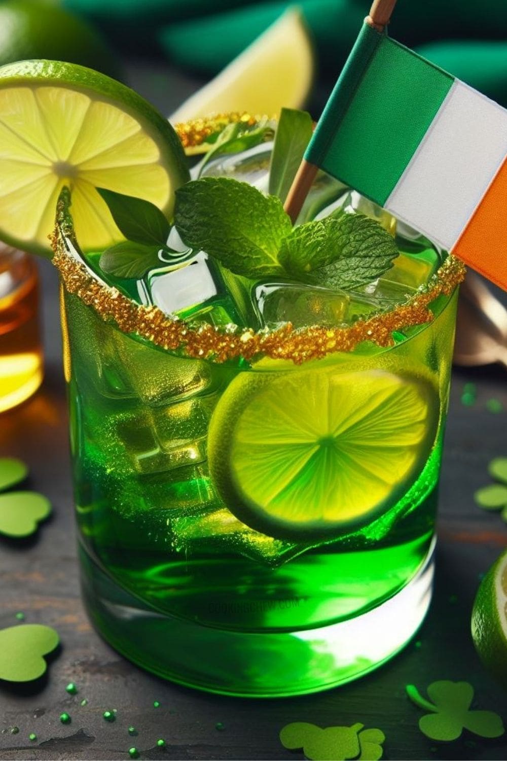A glass of irish drink with a slice of lime on a wooden table.
