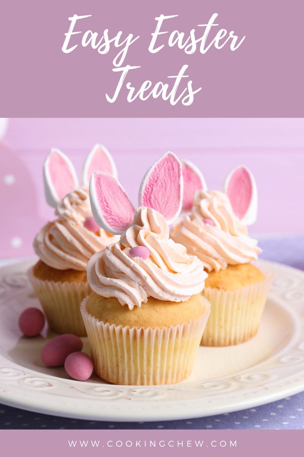 A plate of Easter cupcakes decorated with bunny ears made of marshmallows.