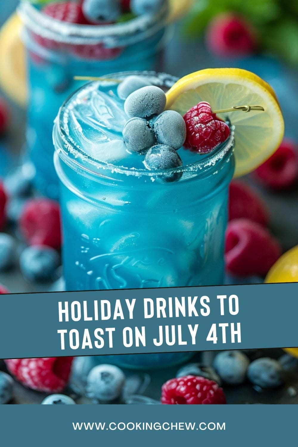A blue raspberry vodka lemonade drink with raspberries and blueberries on a table.