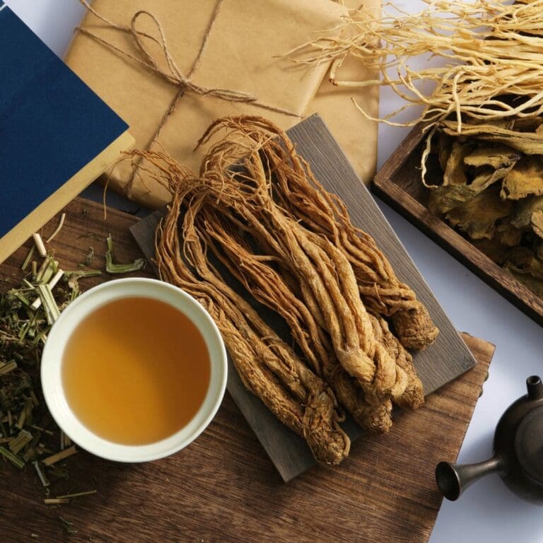 A close-up photo of angelica sinensis roots on a rectangular tray.