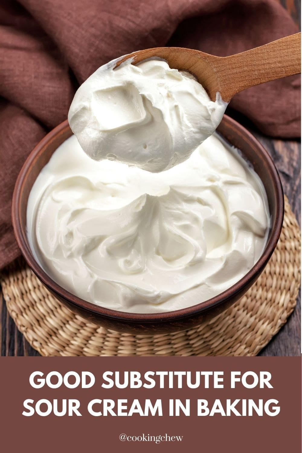 A bowl of sour cream with a spoon filled with our cream on top.