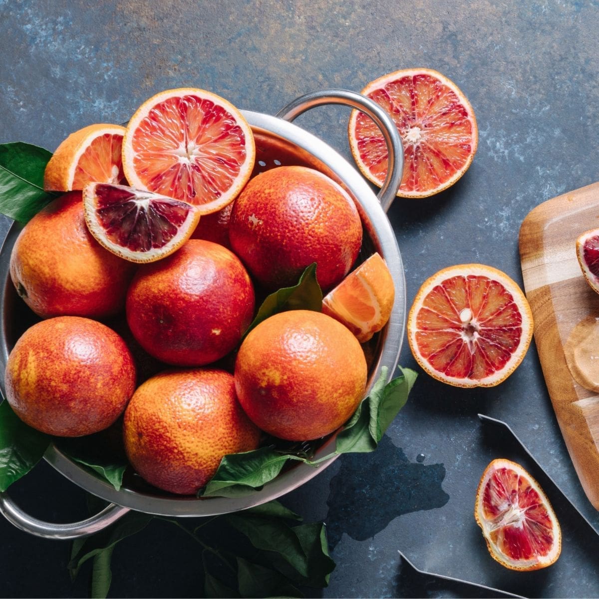 A close-up view of a cluster of blood oranges.