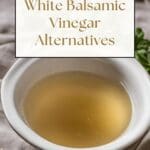 A close-up of a white porcelain bowl filled with white balsamic vinegar, sitting on a wooden table.