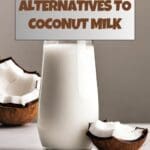 A refreshing summer drink of coconut milk served in a glass on a wooden table.