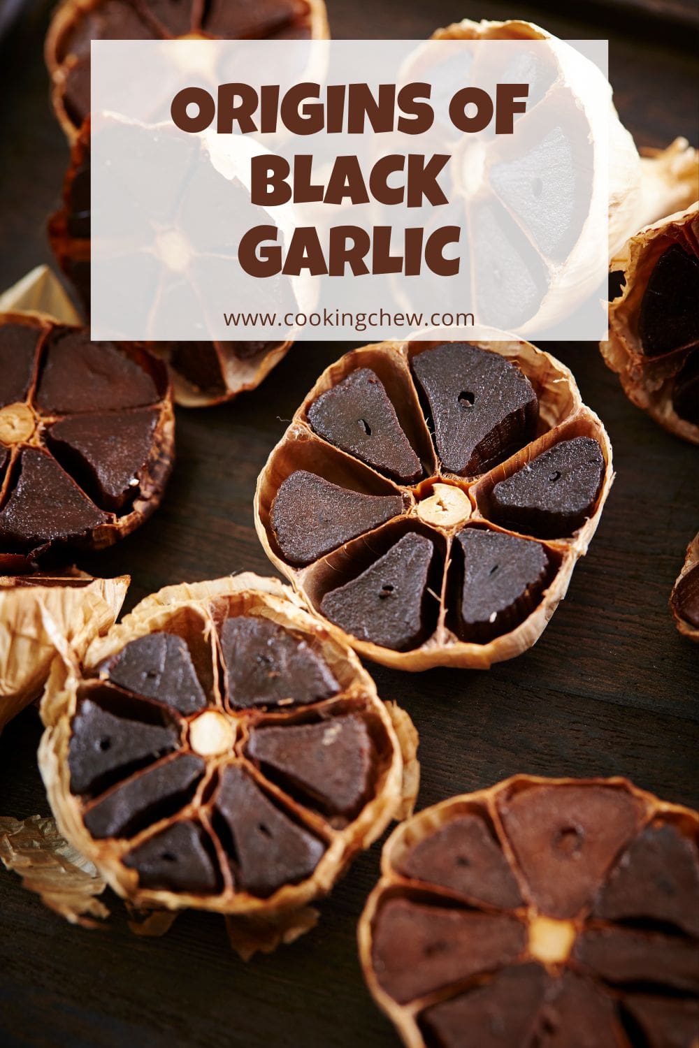 A close-up photo of a black garlic bulb with several cloves, some peeled and some still in their skins.