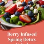 A photo of a healthy and detoxifying salad made with strawberries, blueberries, feta cheese, and mixed greens.