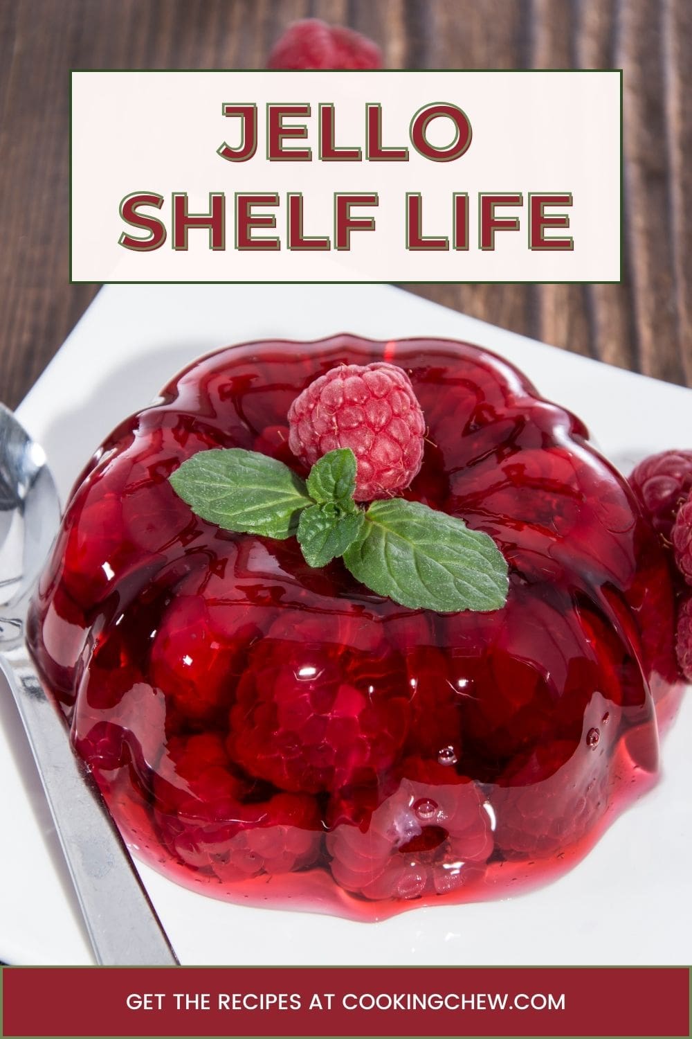 A close-up photo of red raspberry Jello on a white plate.