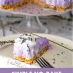 A slice of lavender cheesecake on a white plate with a fork.
