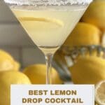A lemon drop cocktail in a martini glass on a wooden table.