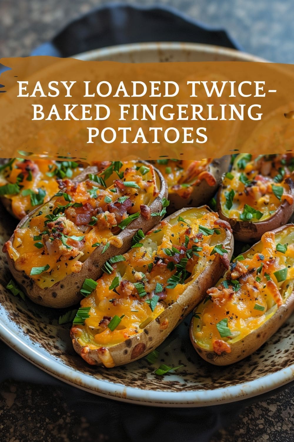 A plate of golden brown and crispy loaded twice-baked fingerling potatoes.