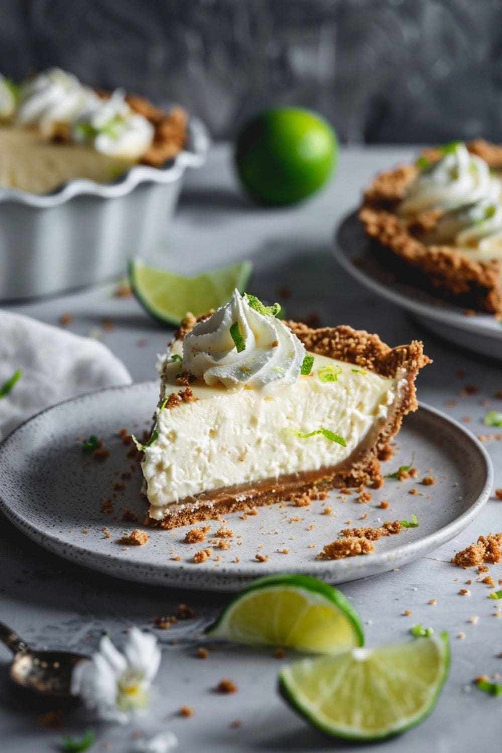 A creamy no bake lime cheesecake with a graham cracker crust, topped with lime zest. Perfect for a refreshing and easy dessert.
