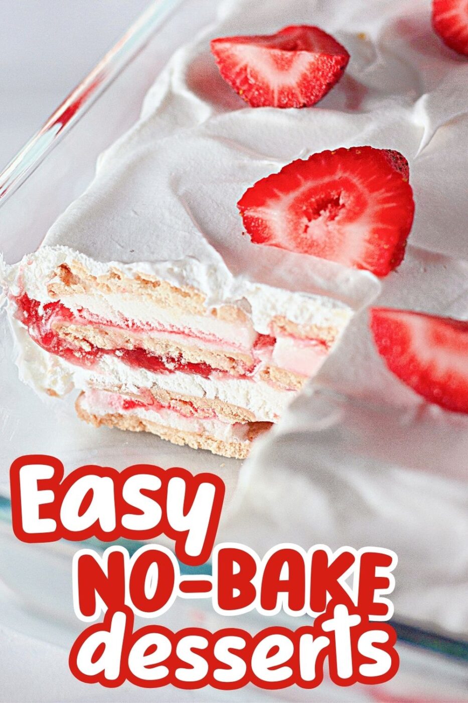 A cross section of layered ice cream cake containing strawberry cheesecake ice cream sandwiches, fresh strawberries, cool whip and strawberry sundae topping