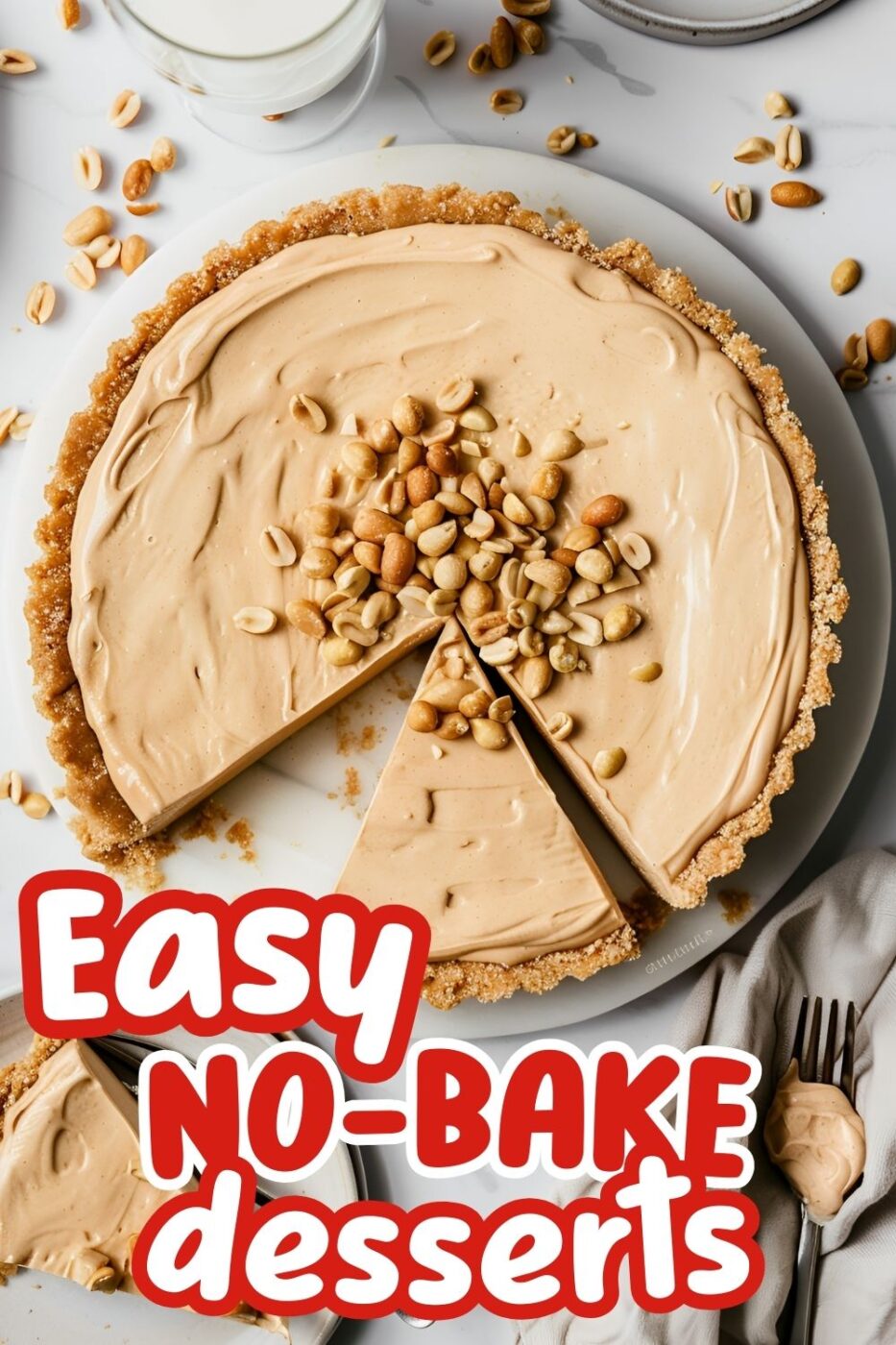 A top down view of a whole peanut butter pie garnished with peanuts in a graham cracker crust