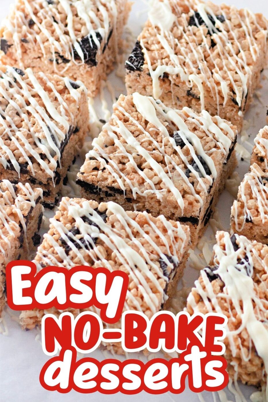 Squares of Rice Krispies Treats containing pieces of OREO cookies and drizzled with vanilla glaze